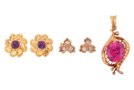 A pendant and two pairs of earrings; the pendant set with an oval-cut synthetic ruby, in yellow meta