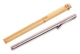 A Tiffany & Co. ballpoint pen and a Cartier ballpoint pen; the Tiffany & Co. pen designed by