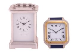 A Tiffany & Co carriage clock, with Roman numerals, quartz movement, in branded box with hinged 