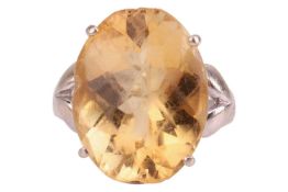 A citrine cocktail ring, the oval chequerboard-cut citrine of 19.3 x 15.0 x 9.7 mm, in claw setting 