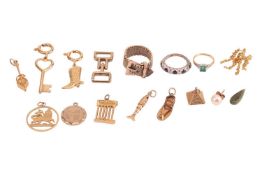 A small group of jewellery items; to include examples of two circular charms, a belt design mesh rin
