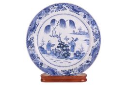 A very large Chinese blue and white porcelain charger on stand, late 18th/early 19th century, depict