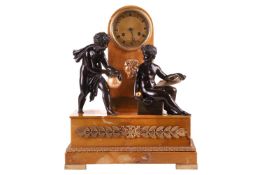 A French Empire bronze, sienna marble and ormolu mounted mantel clock, the gilt dial inscribed Caill