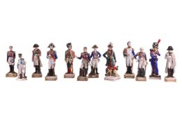 A collection of twelve Napoleonic porcelain and ceramic military figures, Meissen, Sitzendorf, Rosen