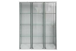 Three glazed narrow four-glass display cabinets, each with three glass shelves, 163.5 cm high x 42.5