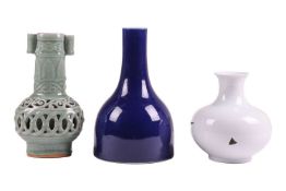 A Chinese monochrome blue bottle vase, 20th century, with apocryphal Qianlong seal mark, 27 cm high,