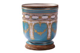 A 19th century French porcelain jardiniere with gilt metal mounts, a band of floral garlands over a 