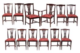 A set of twelve mahogany dining chairs in the Chippendale manner, c.1900, comprising Pair of Armchai