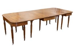 A late George III mahogany D-end dining table with, comprising two 