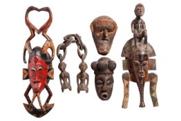 Five African masks, and carvings, Ivory Coast Guro and others.