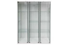 Three glazed narrow four-glass display cabinets, each with three glass shelves, 163.5 cm high x 42.5