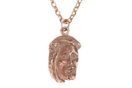 A religious icon pendant on chain, the 9ct gold pendant modelled as the head of Jesus, 3.0 cm drop, 