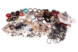A large quantity of costume jewellery; to include a collection of bangles, and a large number of bea