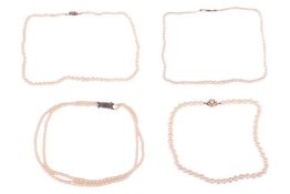 Four cultured pearl necklaces; including two graduated single-row pearl necklaces, one with a 9ct go