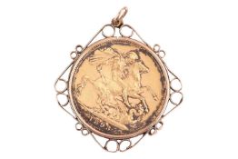 A Victoria full sovereign mounted in 9ct gold pendant, the 1893 sovereign in a detachable scrollwork