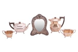 An early 20th-century silver composite four-piece tea set, Sheffield 1935 and other dates, by Edwin 