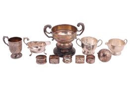 A Victorian Christening mug, tapering cylindrical with beaded scroll handle, and skirt foot, the sid