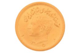 A Persian 1972 gold Pahlavi coin, 8.1 grams, 23 mm diameter.