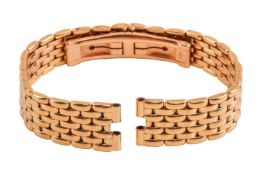 A watch bracelet of brick link style, deployment clasp, yellow metal struck with Italian assay marks