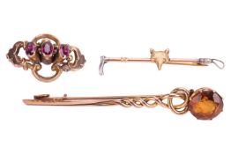 Three bar brooches; to include a Victorian garnet brooch in a repousse floral surround, in yellow me