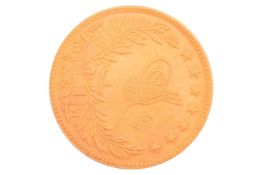 A Turkish five-hundred kurush gold coin, 36 grams, 34 mm diameter