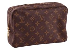 Louis Vuitton - a Trousse Toilette clutch bag in brown monogrammed canvas, zip closure, gold-tone ha