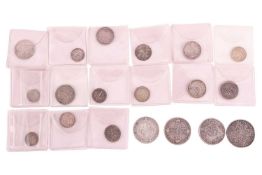 A collection of British 18th/19th century silver coins, including a 1713, Queen Anne shilling, 1817,