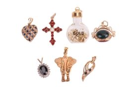 A group of pendants, to include a hardstone fob pendant, a ruby & sapphire heart shaped pendant 