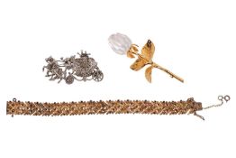 A small group of jewellery, to include a gilt bracelet marked ‘Silver’, comprising a series of abstr