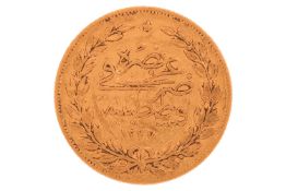 A Turkish one hundred kurush gold coin, 7.1 grams, 20 mm diameter.