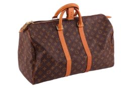 Louis Vuitton - a holdall in brown monogrammed canvas, zip closure with signed padlock and key, equi