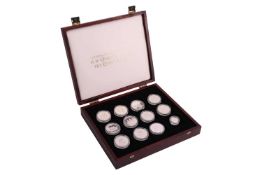 A silver coin set: The Official Coin Collection in Honour of H.M. Queen Elizabeth, The Queen Mother.