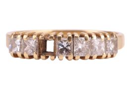A diamond half hoop ring in 18ct yellow gold, set with a row of princess-cut diamonds with an estima