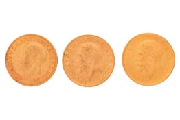 A collection of three gold sovereigns, including British 1914 , South African 1925, and 1929, 23.9 g