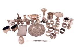 An agglomeration of various silver items to include a Dutch pierced silver ashtray, a christening cu
