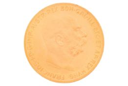 A 1915 Austrian one hundred corona gold coin, bearing the bust of Emperor Franz Joseph I, 33.9 grams