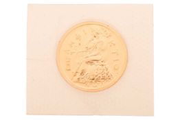 A Greek ten-thousand proof drachma gold coin, in its original shrink-wrapped covering of issue. 20 g