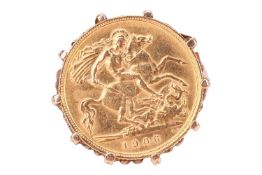 An Edward VII 1906 half sovereign set in ring, scrolled gallery and shoulders to tapering shank, yel