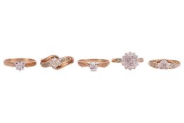 A group of five gem-set rings; The first an illusion-set diamond solitaire ring, featuring an illusi