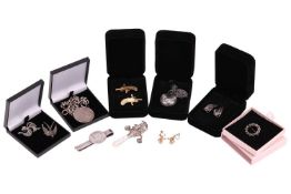 A silver curb pattern watch chain, now a bracelet suspending a George III, a white metal tie bar, wi