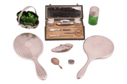 A boxed lady's manicure table set, together with two silver-backed hand mirrors, a miniature hand mi