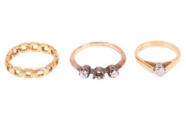 A 22 carat gold ring in the form of a fixed chain link band; size M; together with a single stone di