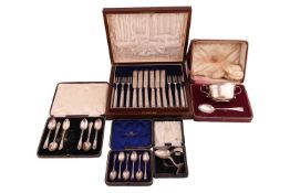 A cased set of silver fruit knives and forks, Sheffield 1925 by Harrison Brothers, all with loaded h