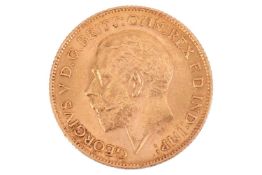 A 1911 George V half sovereign, obverse bare head to the left.