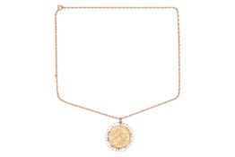 A 1904 Edward VII full sovereign in a detachable scrolled mount with suspension loop, British assay 