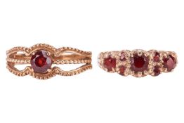 Two garnet-set dress rings in 9ct yellow gold; one in the style of a half-hoop ring sized P, and ano