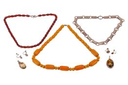 A small group of mixed jewellery items comprising an oval bezel-set burnt amber pendant, an oval cit