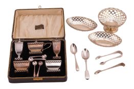 A cased nine-piece silver table cruet set, Birmingham 1919, by Deakin & Francis, together with t