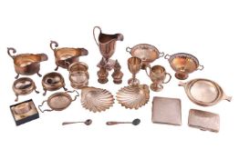 A small agglomeration of silver items, including scallop shell butter dishes, a 20th-century two-han