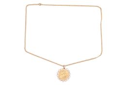 A 1914 George V full sovereign in a detachable scalloped mount with suspension loop, metal testing a